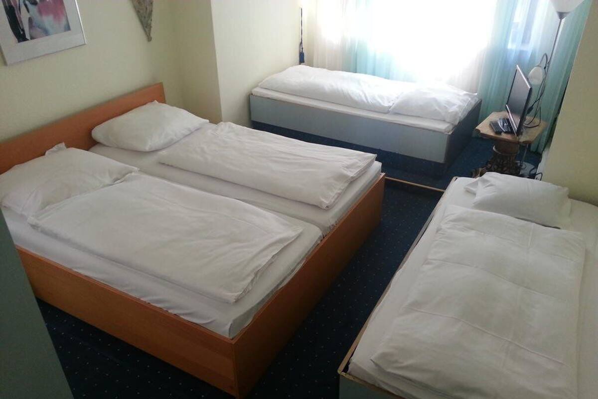 Kamar Triple | Minibar, meja kerja, kedap suara, dan setrika/meja setrika