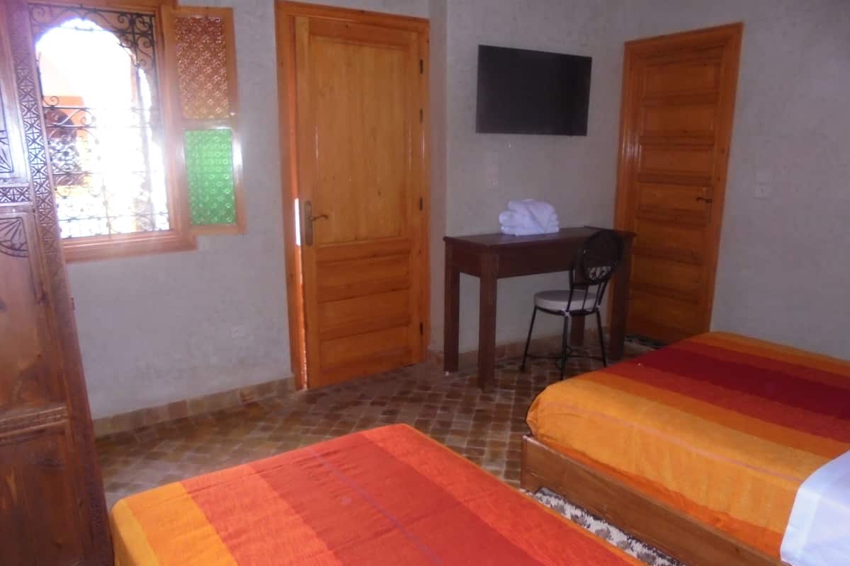 Superior Triple Room | Minibar, in-room safe, desk, iron/ironing board