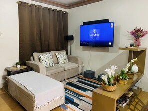 Smart TV, books - *Accessible 2BR condo close to SM Marikina/LRT 2* (Pasig)
