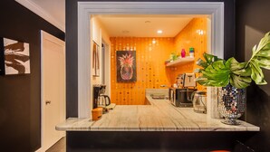 A modern kitchen with a marble countertop, a coffee machine, and a toaster. - PALM BEACH HOTEL CONDO DESIGNER CHIC ONE BEDROOM (Palm Beach)