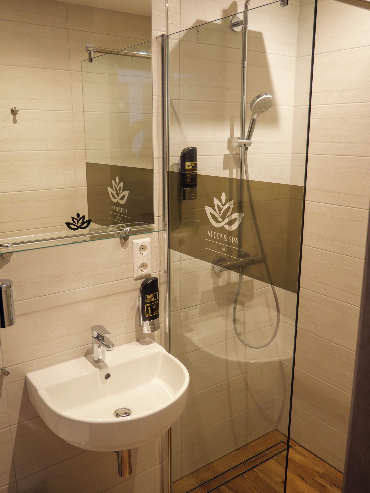 shower, hair dryer, towels, toilet paper