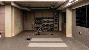 A gym with kettlebells, dumbbells, and exercise mats. - Locke At Broken Wharf (London)