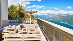 A balcony with outdoor seating, a pergola, and a scenic mountain view. - VILLA PRESTIGE - Eight Bedroom Villa, Sleeps 14 (Pigra)