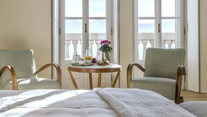 A room with a bed, two chairs, a table with breakfast items, and large windows with a view. - VILLA PRESTIGE - Eight Bedroom Villa, Sleeps 14 (Pigra)