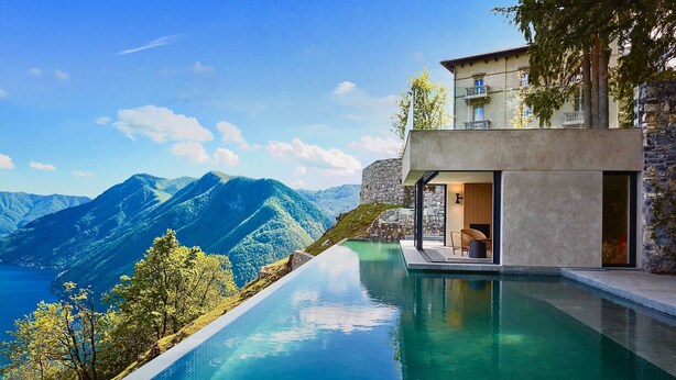 A modern villa with a private infinity pool overlooking a mountainous landscape. - VILLA PRESTIGE - Eight Bedroom Villa, Sleeps 14 (Pigra)