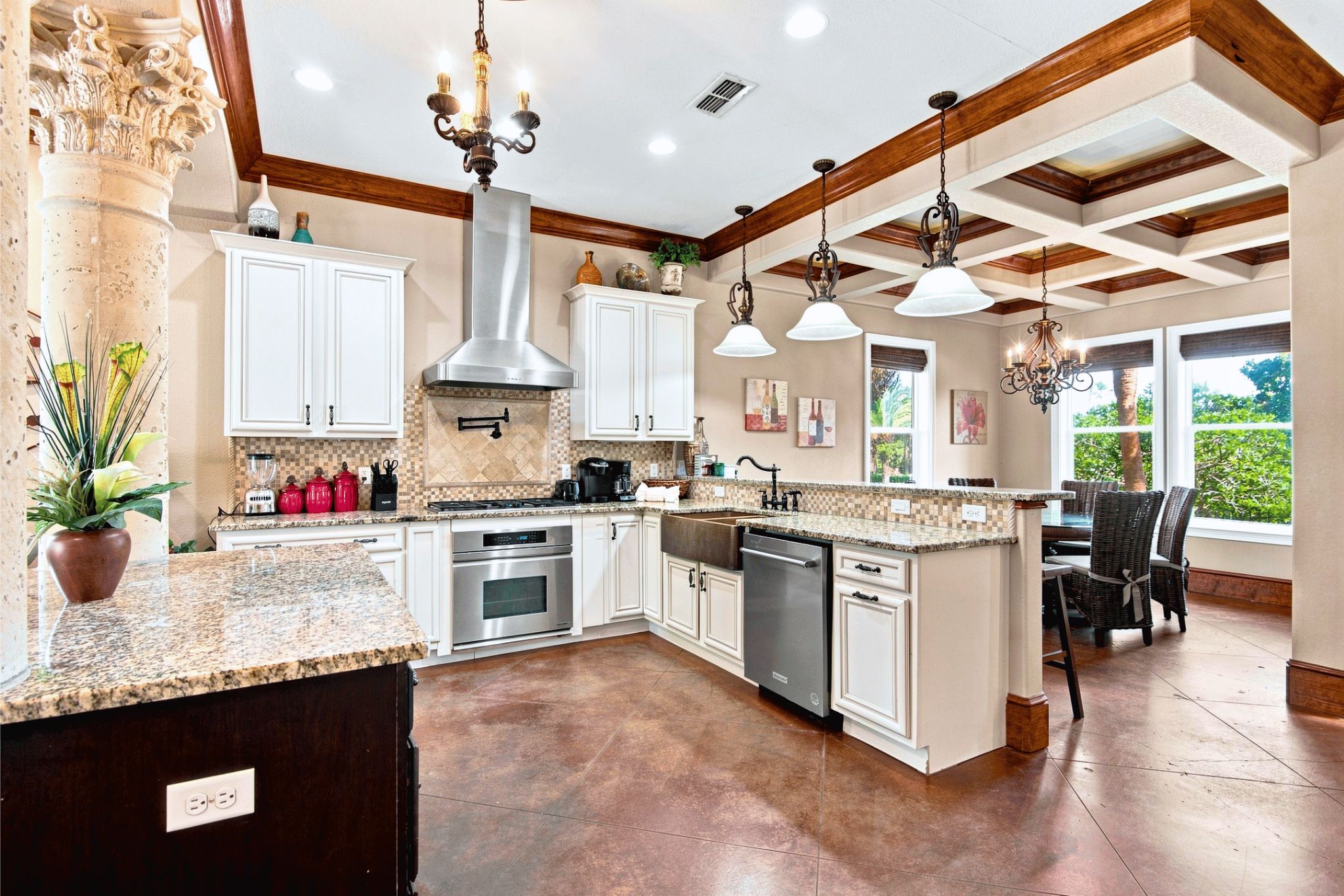 A spacious kitchen with granite countertops, stainless steel appliances, and a large island.