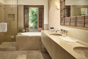 Enjoy a relaxing soak in the bathtub or refresh in the glass-enclosed shower.