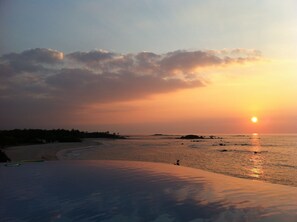 Enjoy a serene beach experience with gentle waves and a peaceful atmosphere.