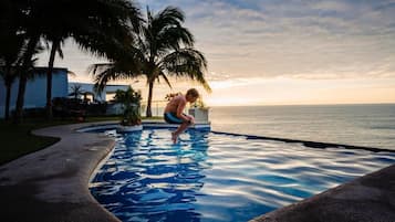 Outdoor pool, pool umbrellas, pool loungers