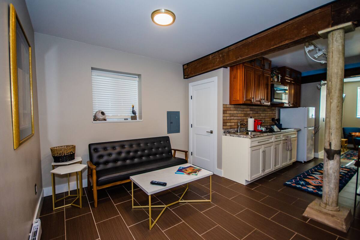 luxury suite, 1 bedroom, kitchen, ground floor (crawford) | living area | 50-inch led tv with cable channels, tv, netflix