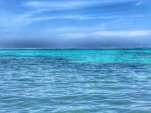 On the beach, sun-loungers, beach towels