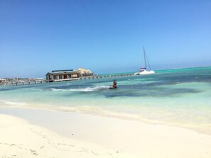 On the beach, sun-loungers, beach towels