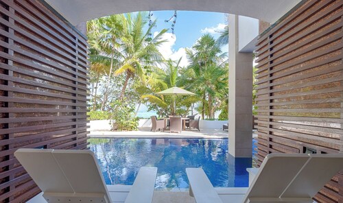 Modern upscale beachfront villa, perfect for a wedding, reunion or more!