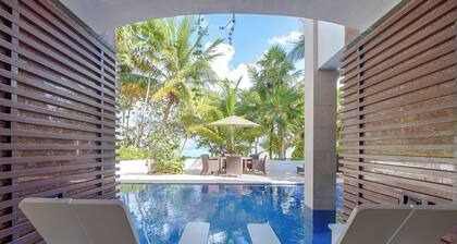 Modern upscale beachfront villa, perfect for a wedding, reunion or more!