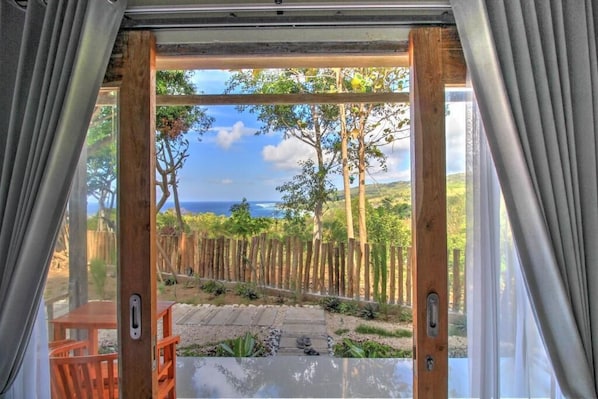 Habitación doble Deluxe, vista al mar | Terraza o patio