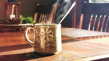 A mug with a floral design on a wooden table.