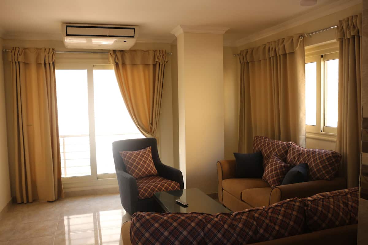 Standard Apartment | Living area | 52-inch Smart TV with satellite channels, TV