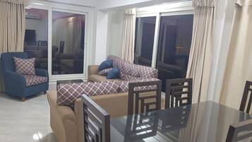 Panoramic Apartment | Living area | 52-inch Smart TV with satellite channels, TV