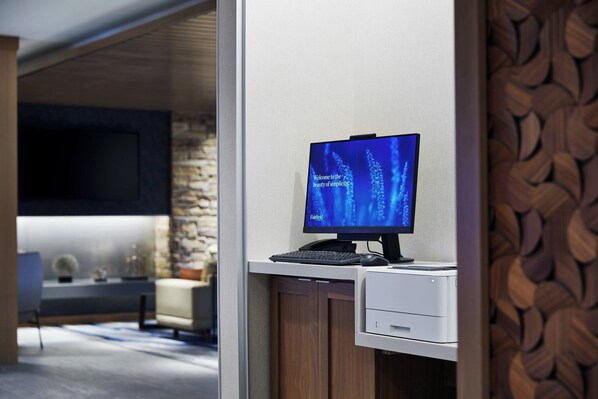 A modern office space with a desktop computer, a flat-screen monitor, and a printer. - Fairfield Inn & Suites by Marriott Sheboygan (Sheboygan)