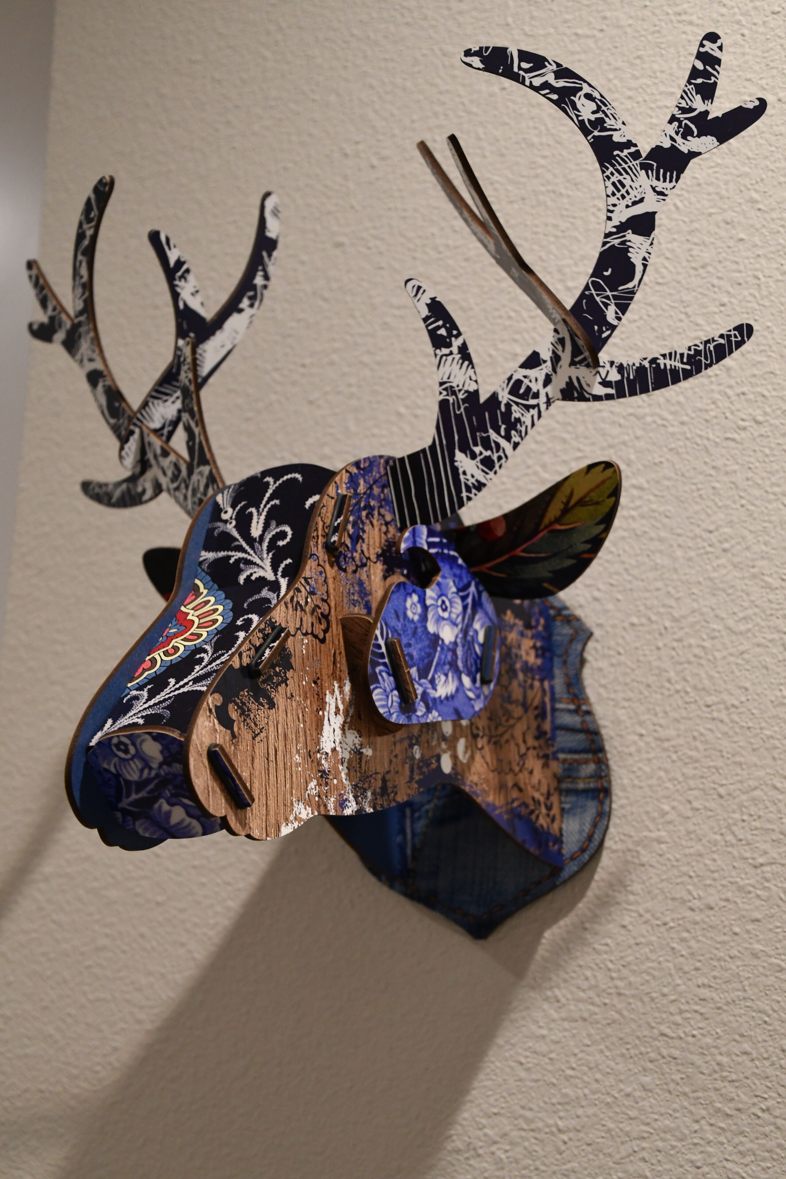 A deer head mounted on a wall.