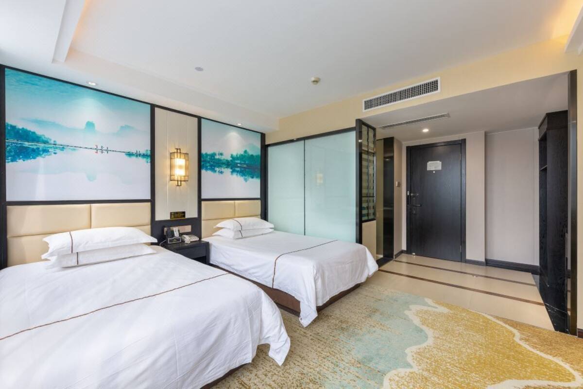 Habitación Deluxe con 2 camas individuales | Cortinas blackout, insonorización, wifi gratis y ropa de cama