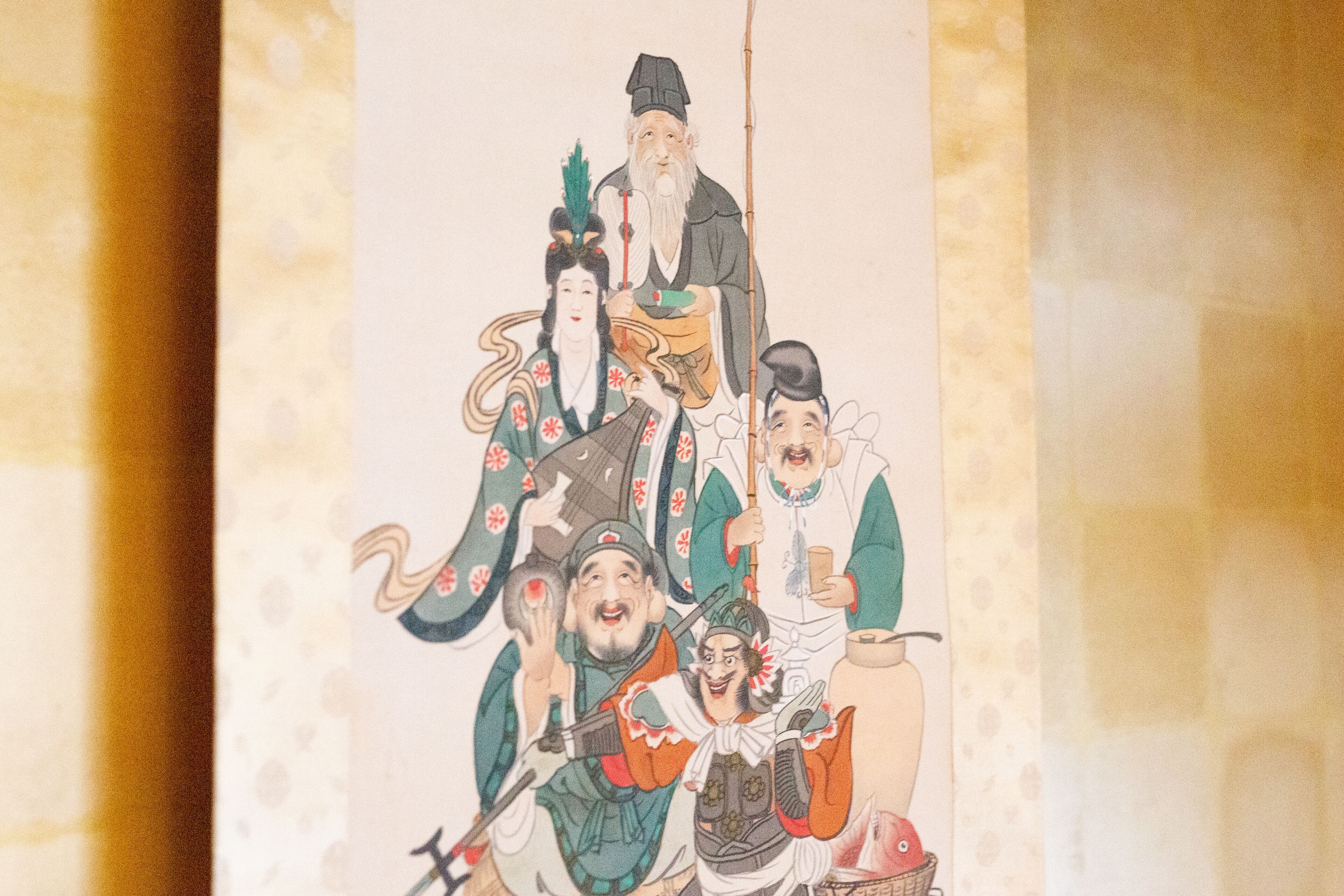 A traditional Chinese painting with figures in historical attire.