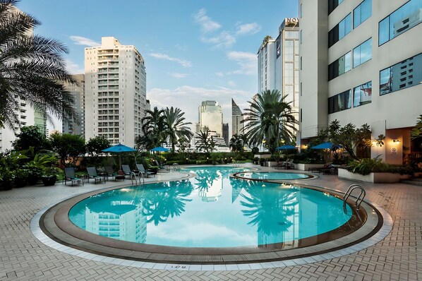 Outdoor pool, open 7:00 AM to 9:00 PM, pool umbrellas, sun loungers