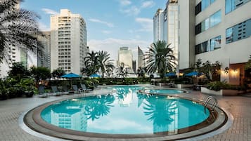 Outdoor pool, open 7:00 AM to 9:00 PM, pool umbrellas, sun loungers