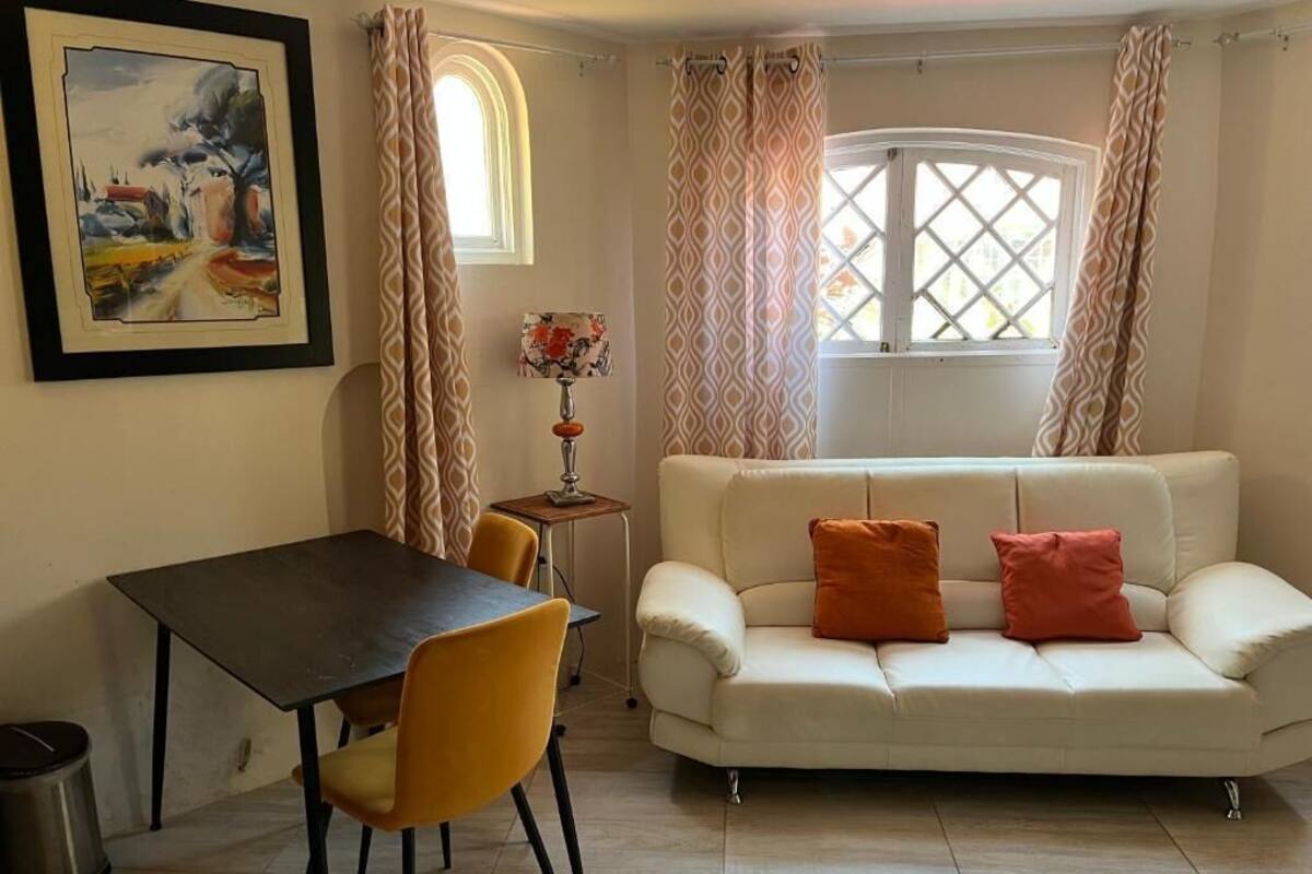 Beautiful 1 Bedroom Ground Floor | Living area | 75-inch TV with digital channels, fireplace, Netflix