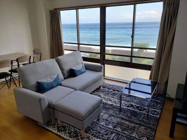 Standard Family Room, Sea View | Living room | 20-inch flat-screen TV with digital channels, TV