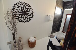 Bathtub, hair dryer, towels, soap