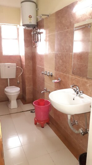 Luxury Double Room | Bathroom | Shower, free toiletries, slippers, towels - Hotel Niladrii Galaxy (Siliguri)