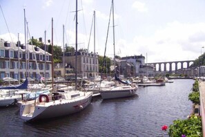 Enjoy serene waterfront views and picturesque sailboats docked along the marina.