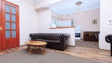 Apartamento, 1 quarto | Área de estar | TV de tela plana