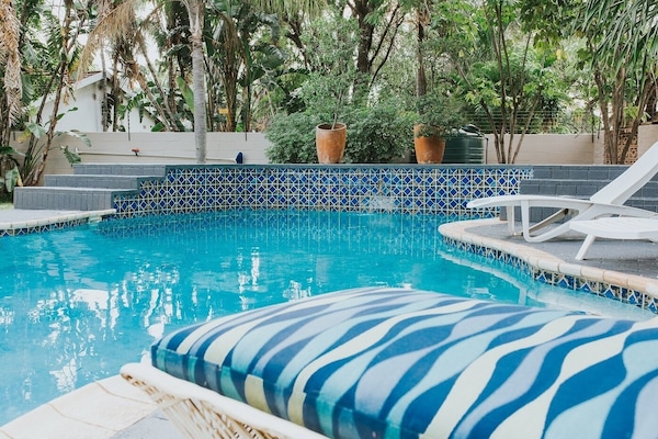 Outdoor pool, pool umbrellas, sun loungers
