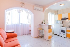 Apartment | Living area | Flat-screen TV - Apartments On European Square (Kyiv)