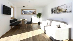 Un salon moderne comprenant un canapé, une table à manger avec des chaises, un téléviseur fixé au mur et une grande fenêtre laissant entrer la lumière naturelle.