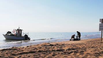 On the beach, sun loungers