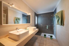 Shower, hair dryer, towels, toilet paper