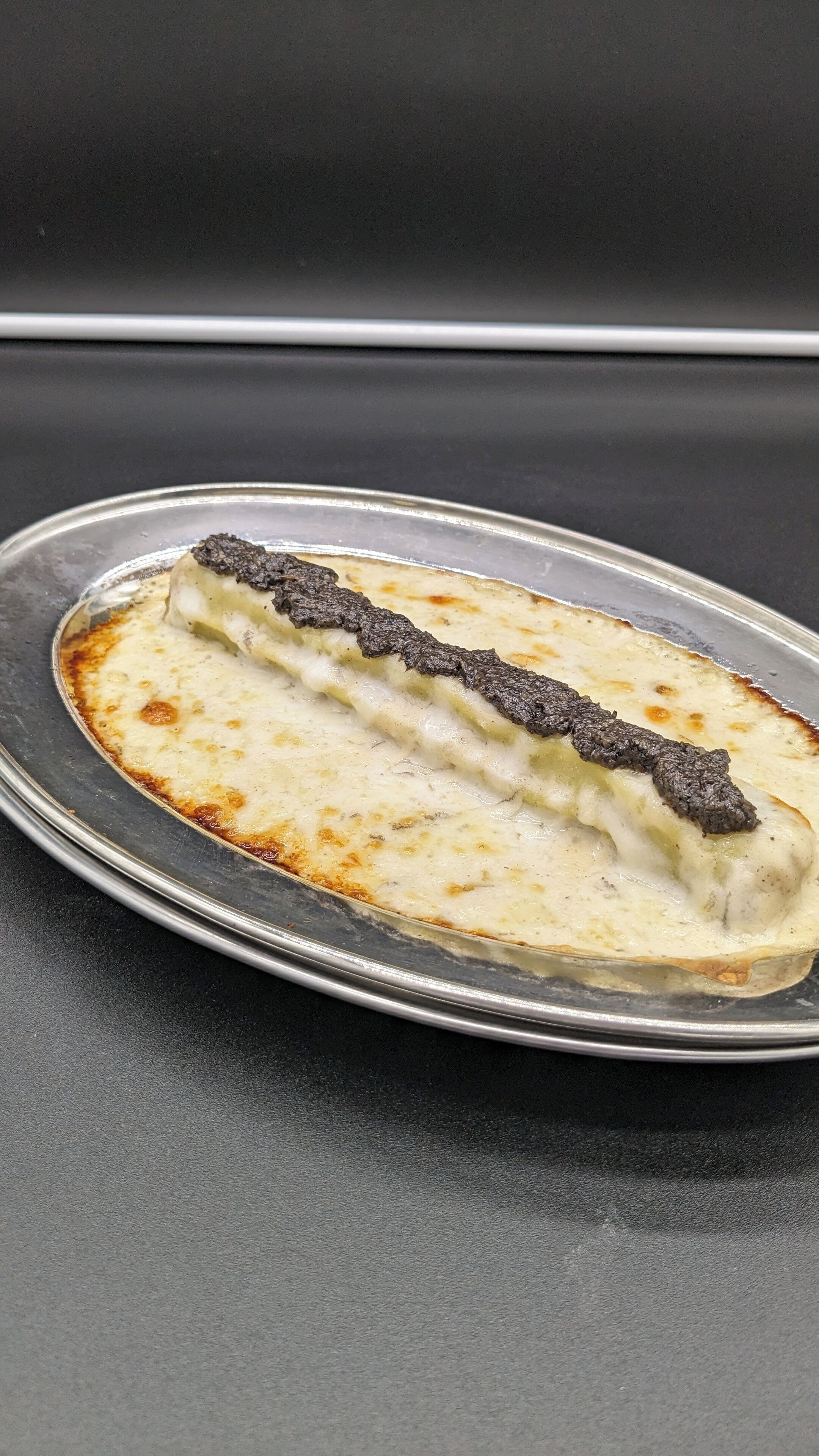 A dessert on a metal plate.