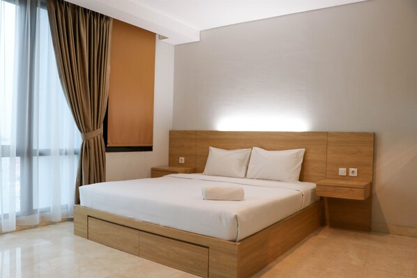 Room | Free WiFi, bed sheets - Spacious Studio Room at Capitol Suites Apartment (Jakarta)