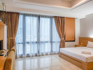 Room | Free WiFi, bed sheets - Spacious Studio Room at Capitol Suites Apartment (Jakarta)