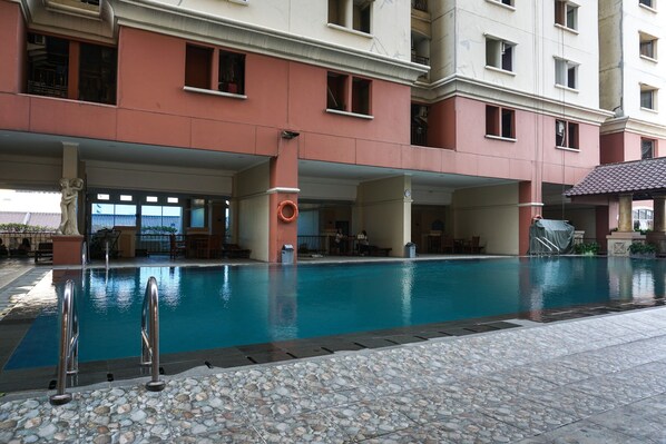 Outdoor pool - Comfy 3BR Apartment at Mediterania Gajah Mada (Jakarta)