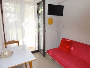 Apartamento, 1 quarto (2) | Área de estar | TV de tela plana