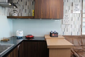 Room | Private kitchen | Fridge, stovetop, cookware/dishes/utensils - Premium Studio Room @ Tamansari La Grande Apartment (Bandung)