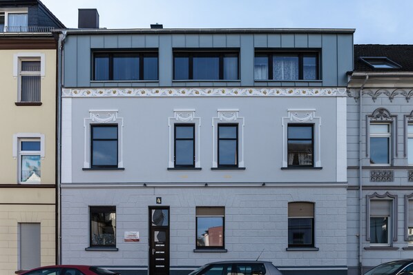 Classic building with a symmetrical facade and evenly spaced windows.