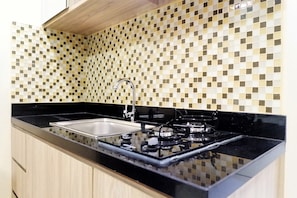 Private kitchenette - Comfy Studio Apartment at Anderson Tower Supermall Mansion (Surabaya)