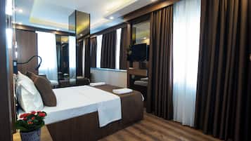 Deluxe Room | Premium bedding, minibar, desk, laptop workspace