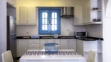 Villa | Private kitchen | Fridge, microwave, cookware/dishes/utensils