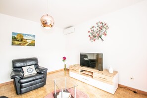 Apartment, 2 Bedrooms | Living area | Flat-screen TV